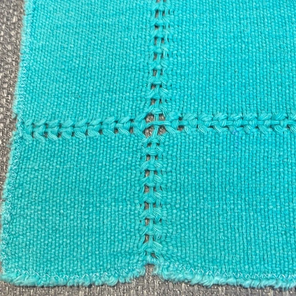 Set of 4 cotton raw edge napkins.